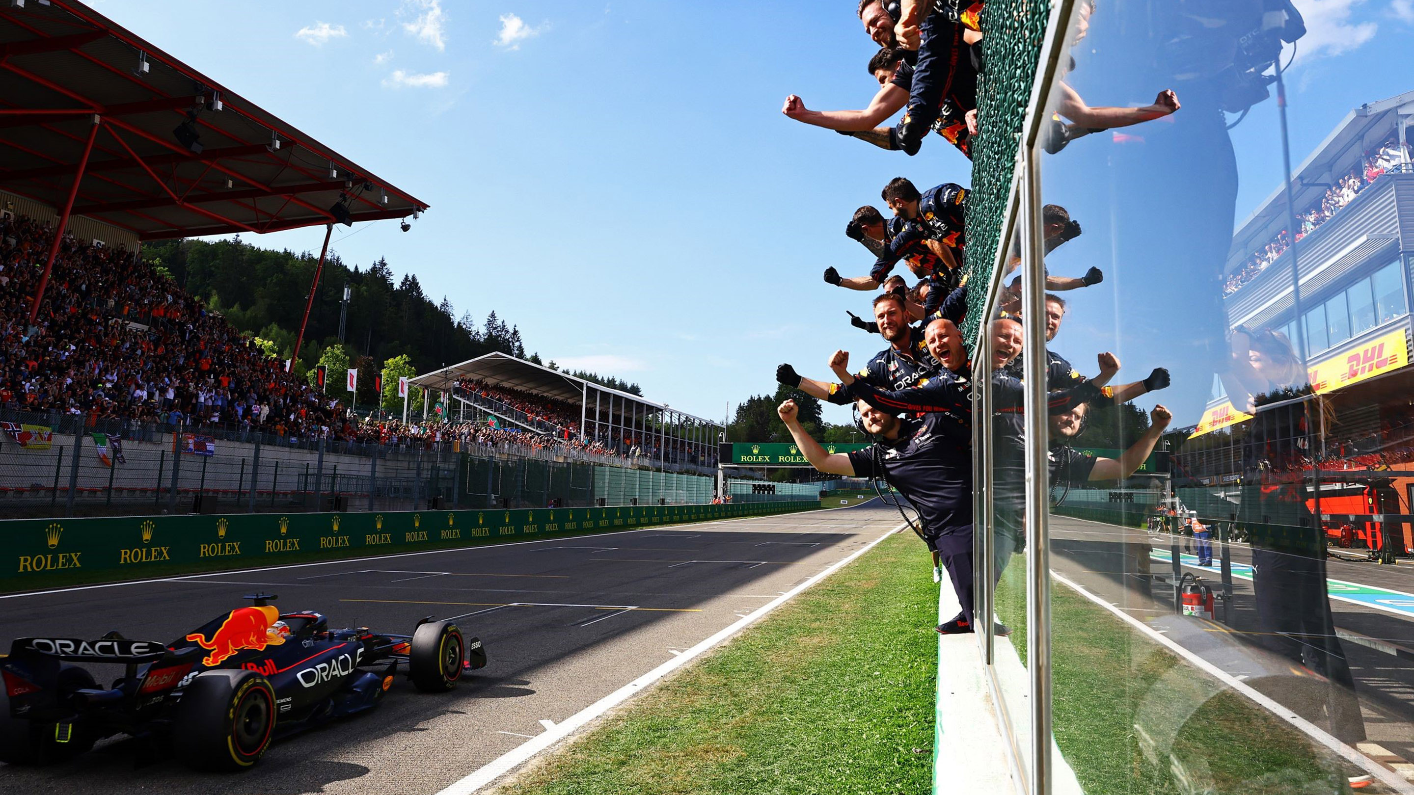 SPA, BELGIUM - AUGUST 28: The Red Bull Racing team celebrate on the pitwall during the F1 Grand Prix of Belgium at Circuit de Spa-Francorchamps on August 28, 2022 in Spa, Belgium. (Photo by Mark Thompson/Getty Images)